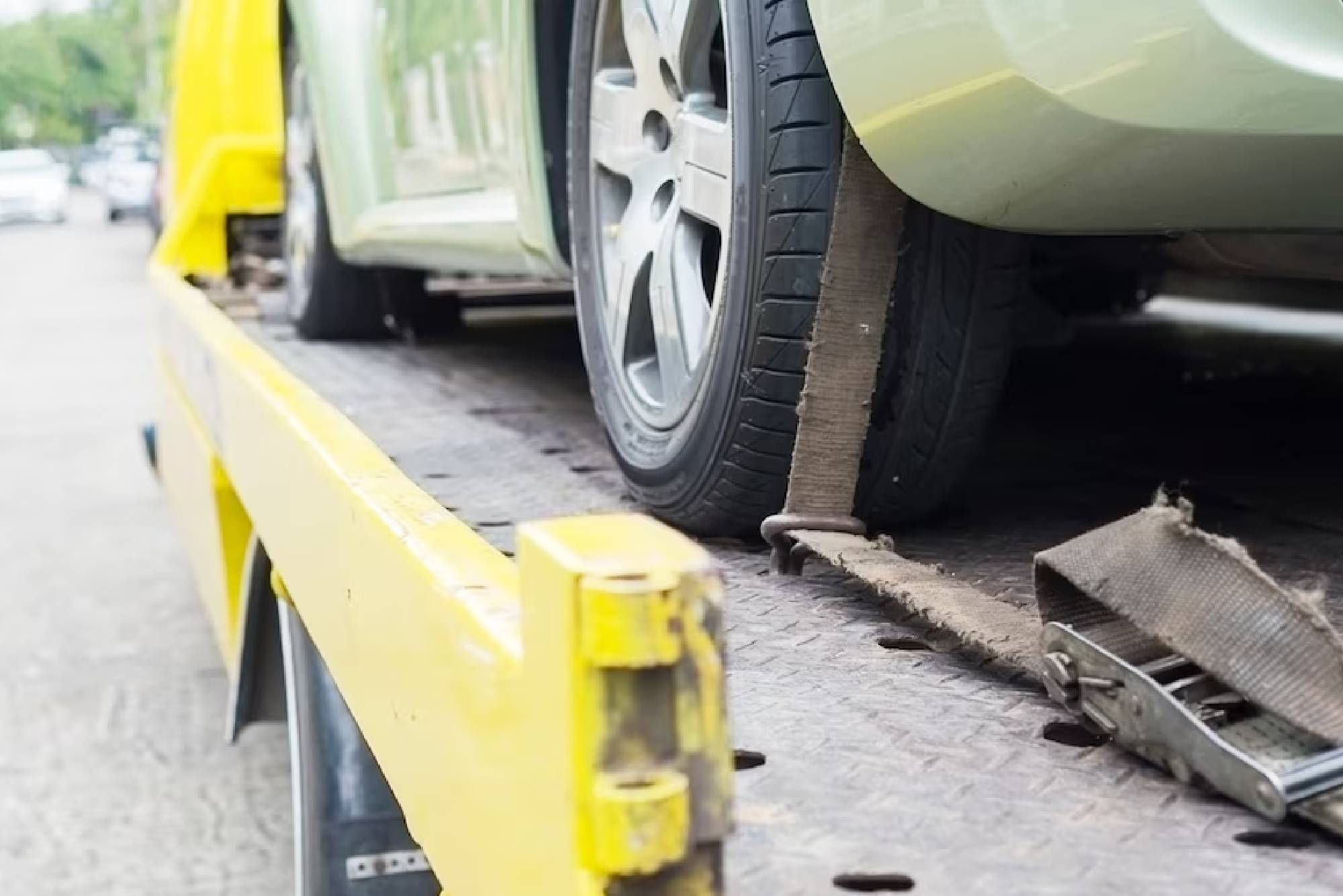 Car transporter breakdown lorry during working using locked belt transport other green car<br />